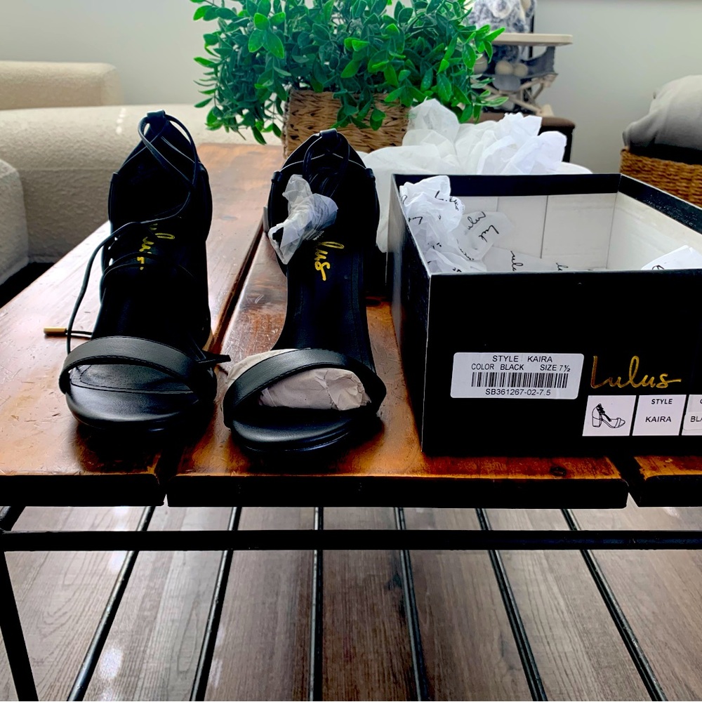 Black leather strappy sandal, never worn, new in original box and packaging